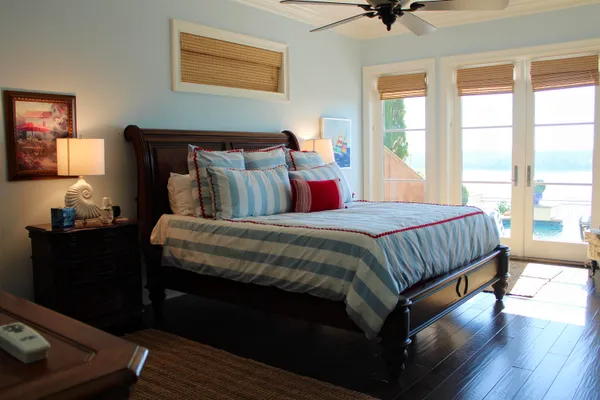 a bedroom with bed and window