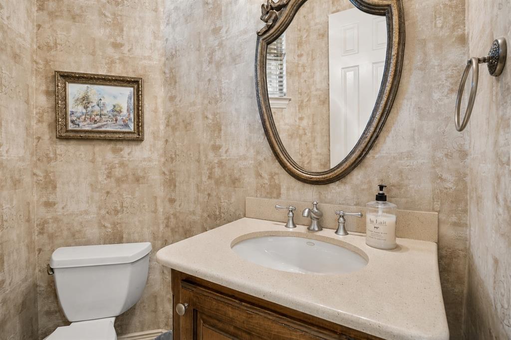 1135 Copper Canyon Road Copper Canyon, TX 76226 - Photo 32 of 40 Elegant Half Bath With Decorative Wall Finish