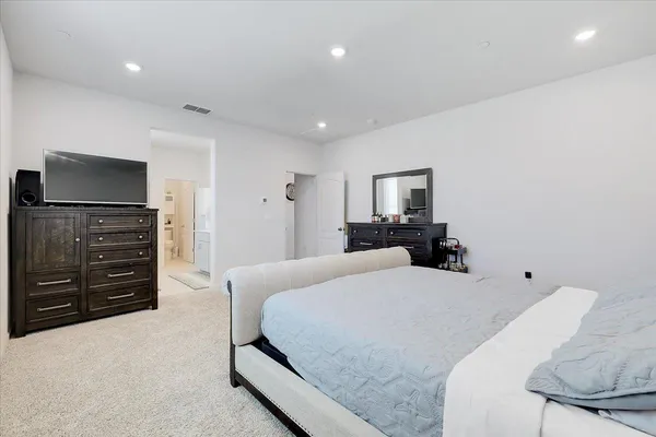 a bedroom with a bed and furniture