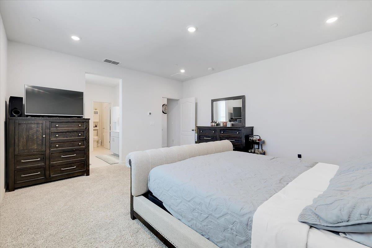 794 Berryessa Way Olivehurst, CA 95961 - Photo 29 of 40 a bedroom with a bed and furniture