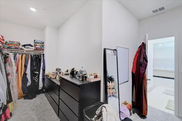 a view of a closet with storage