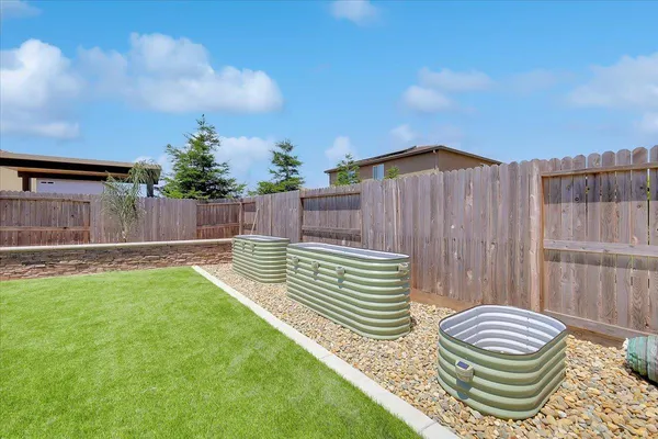 a view of a back yard of the house