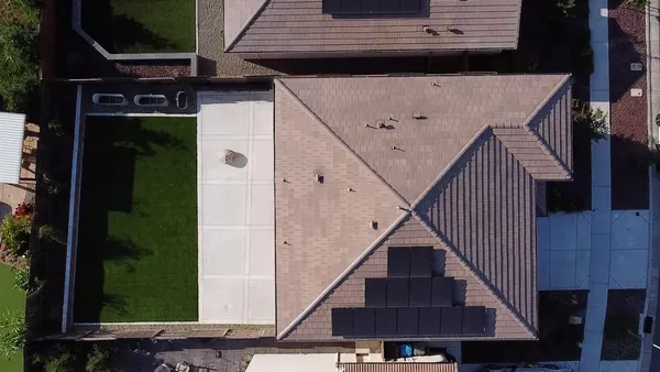 an aerial view of a pool patio swimming pool and outdoor seating