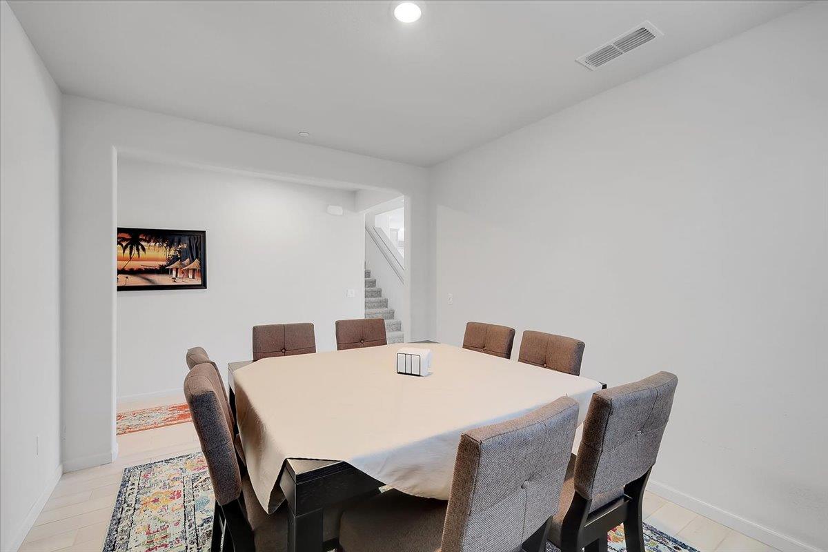 794 Berryessa Way Olivehurst, CA 95961 - Photo 7 of 40 a view of a dining room with furniture and wooden floor