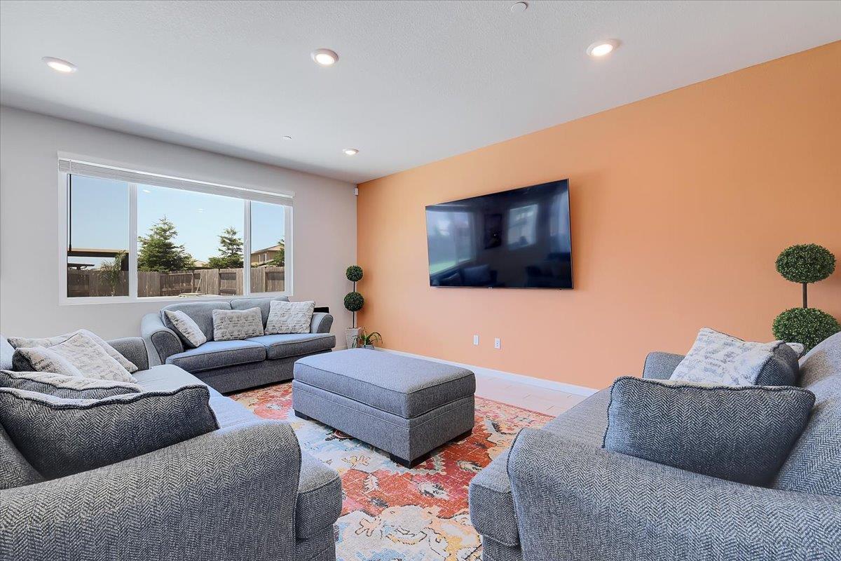794 Berryessa Way Olivehurst, CA 95961 - Photo 8 of 40 a living room with furniture and a flat screen tv