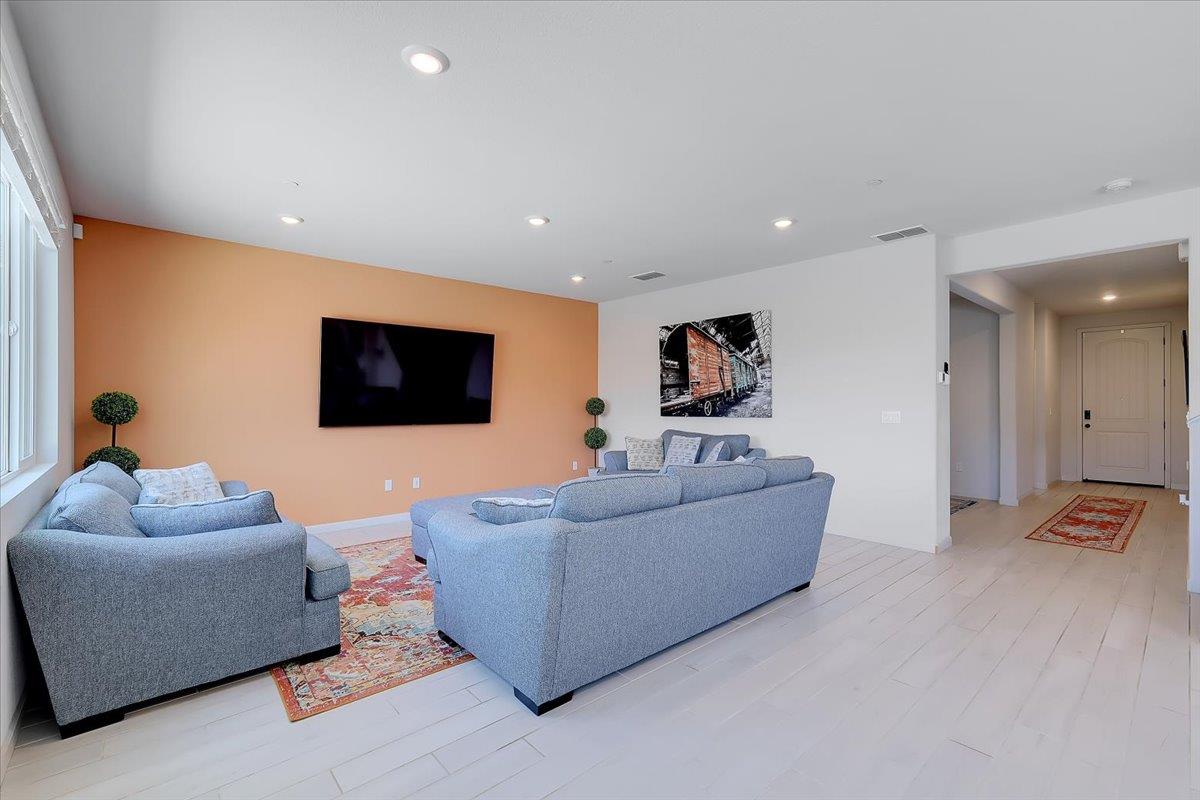 794 Berryessa Way Olivehurst, CA 95961 - Photo 9 of 40 a living room with furniture and a flat screen tv
