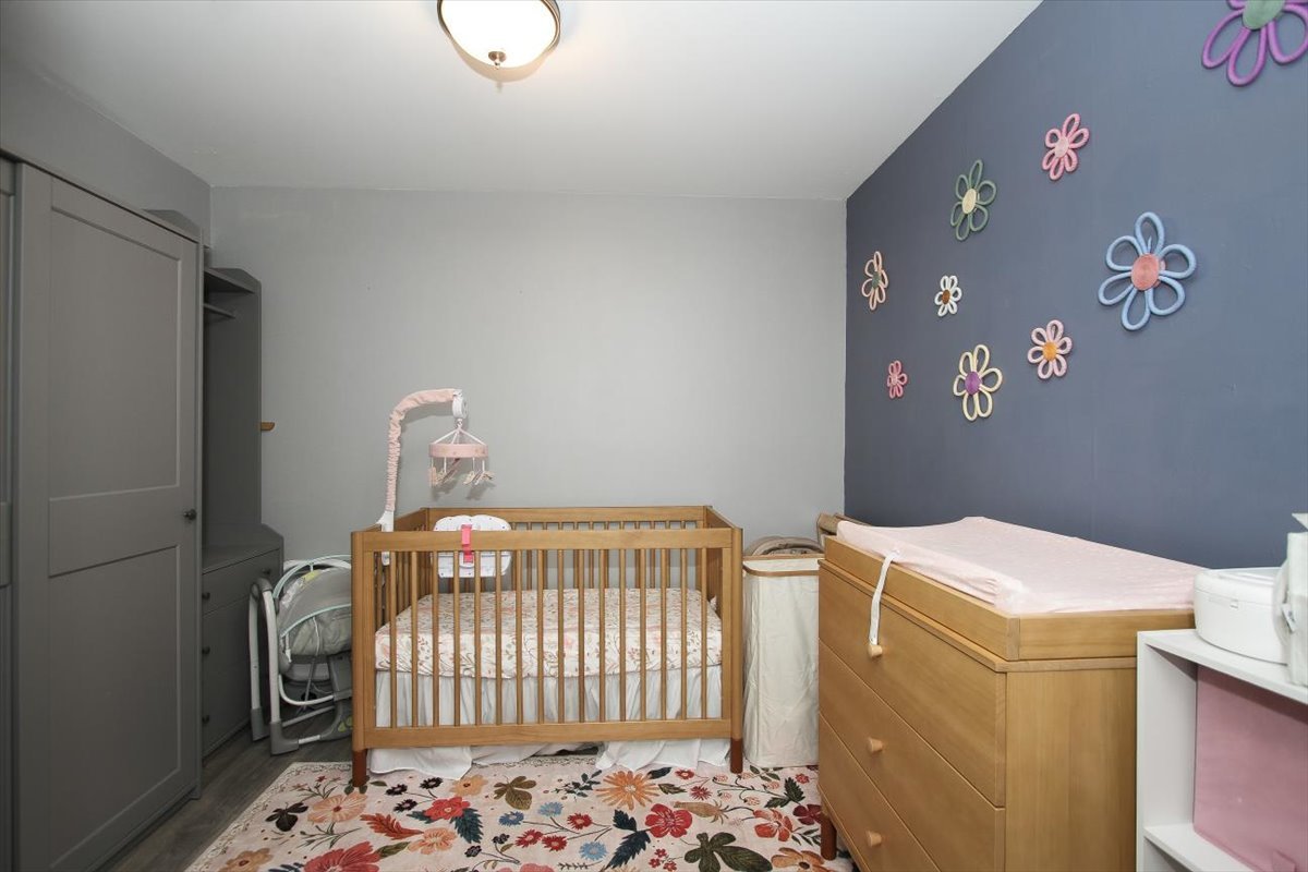2300 Old Tavern Road, Unit 203 Lisle, IL 60532 - Photo 15 of 26 a bedroom with a small bed and a window