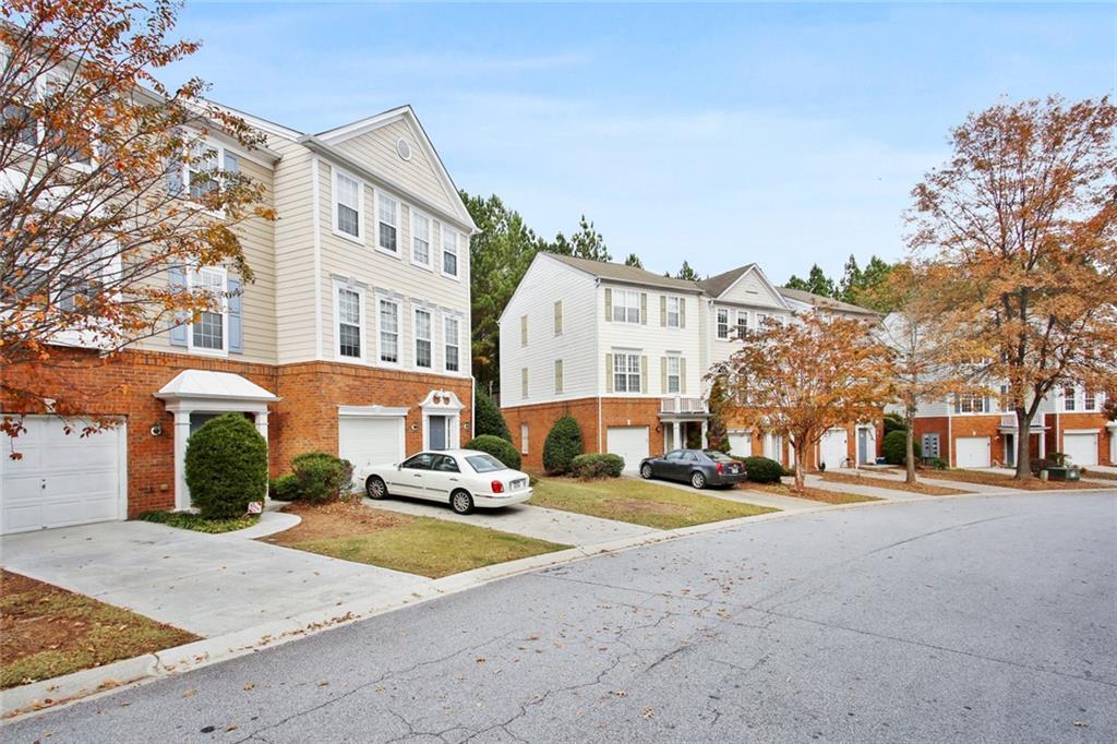 4021 Howell Park Road Duluth, GA 30096 - Photo 1 of 1 a building with trees in front of it