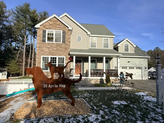 a front view of a house with outdoor seating