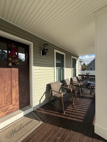 a view of a patio with table and chairs and potted plants