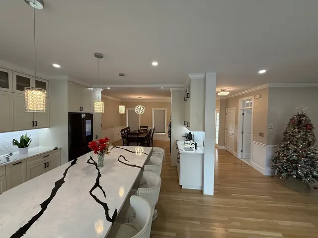 a living room with furniture gym equipment and view of living room