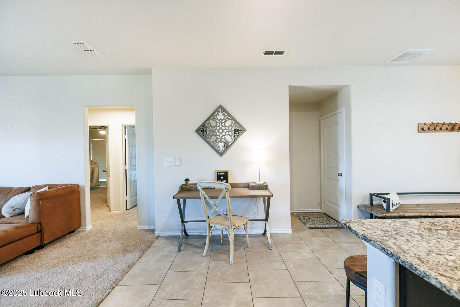 7348 100th Street Lubbock, TX 79424 - Photo 21 of 55 a workspace with furniture and window