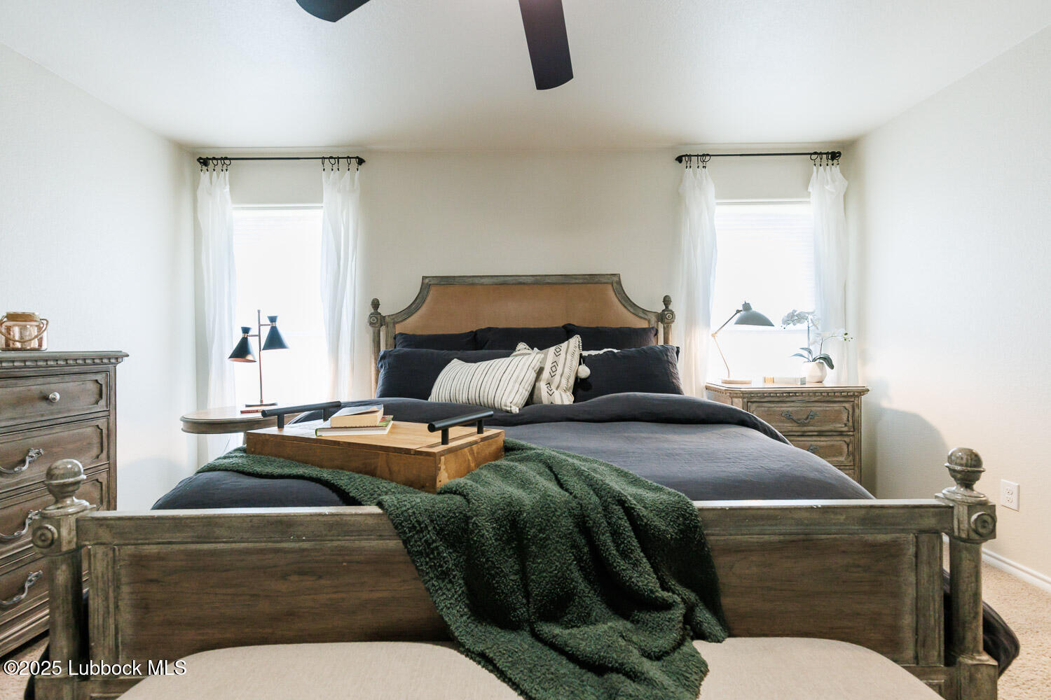 7348 100th Street Lubbock, TX 79424 - Photo 29 of 55 a bedroom with a bed and window