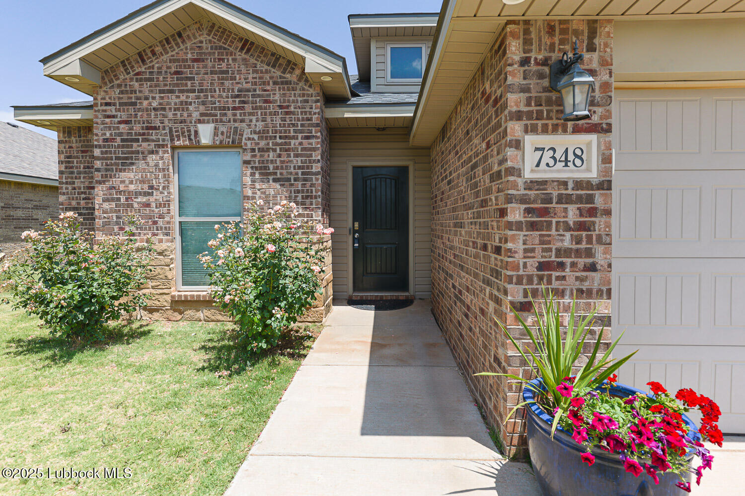 7348 100th Street Lubbock, TX 79424 - Photo 3 of 55 a front view of a house