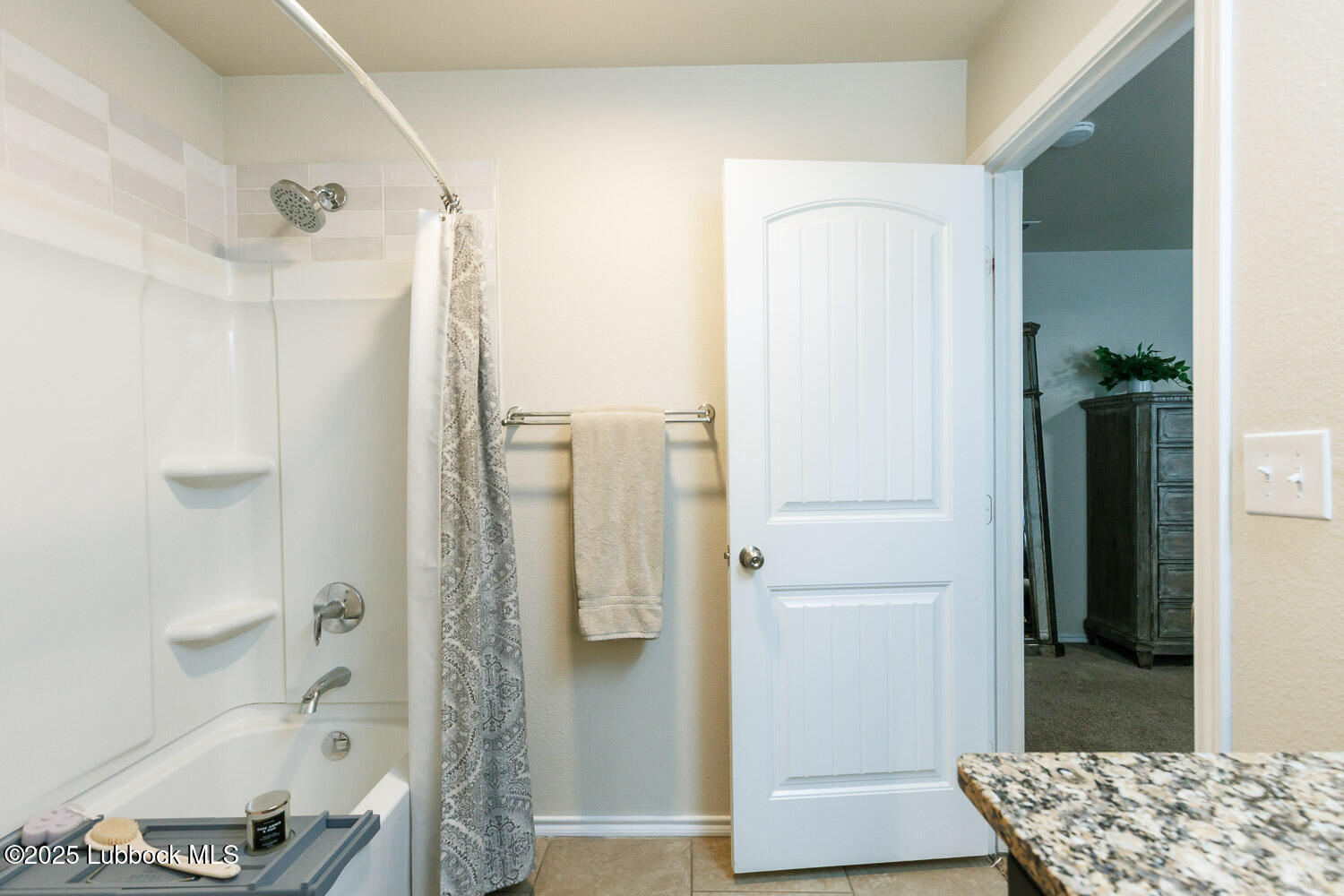 7348 100th Street Lubbock, TX 79424 - Photo 34 of 55 a bathroom with a shower