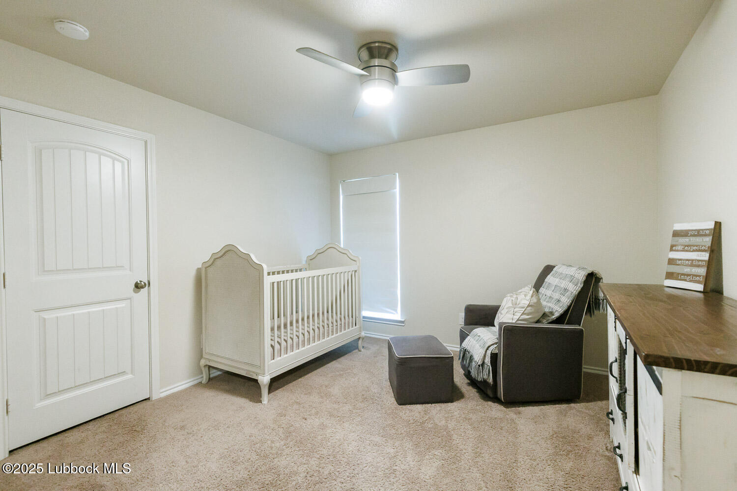 7348 100th Street Lubbock, TX 79424 - Photo 35 of 55 a living room with furniture and a ceiling fan