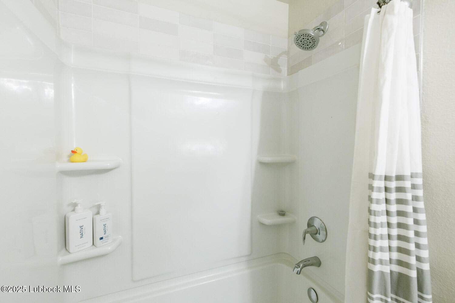 7348 100th Street Lubbock, TX 79424 - Photo 38 of 55 a bathroom with a shower