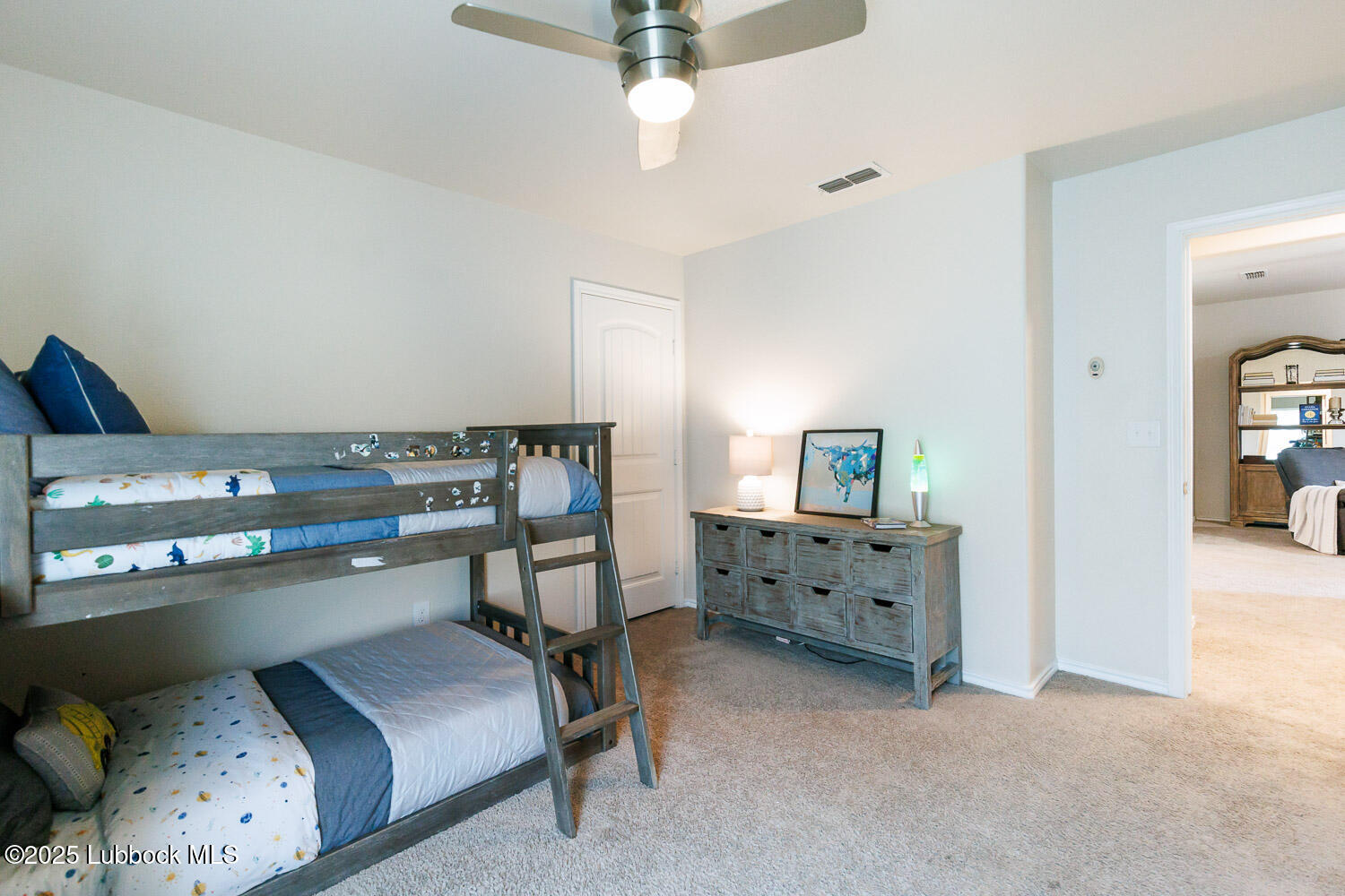 7348 100th Street Lubbock, TX 79424 - Photo 41 of 55 a bedroom with a bed and furniture