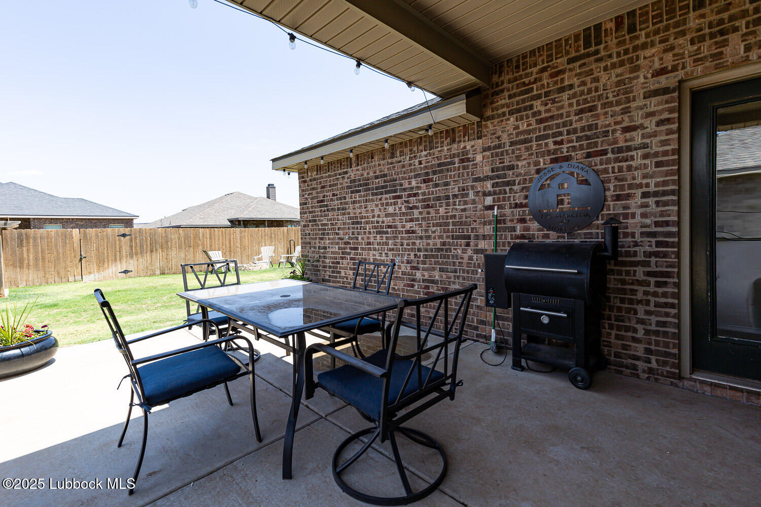 7348 100th Street Lubbock, TX 79424 - Photo 47 of 55 a patio with table and chairs