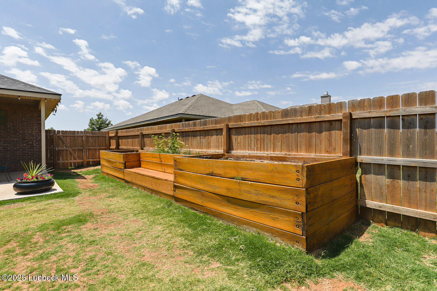 7348 100th Street Lubbock, TX 79424 - Photo 49 of 55 a view of a blue swimming pool with a yard