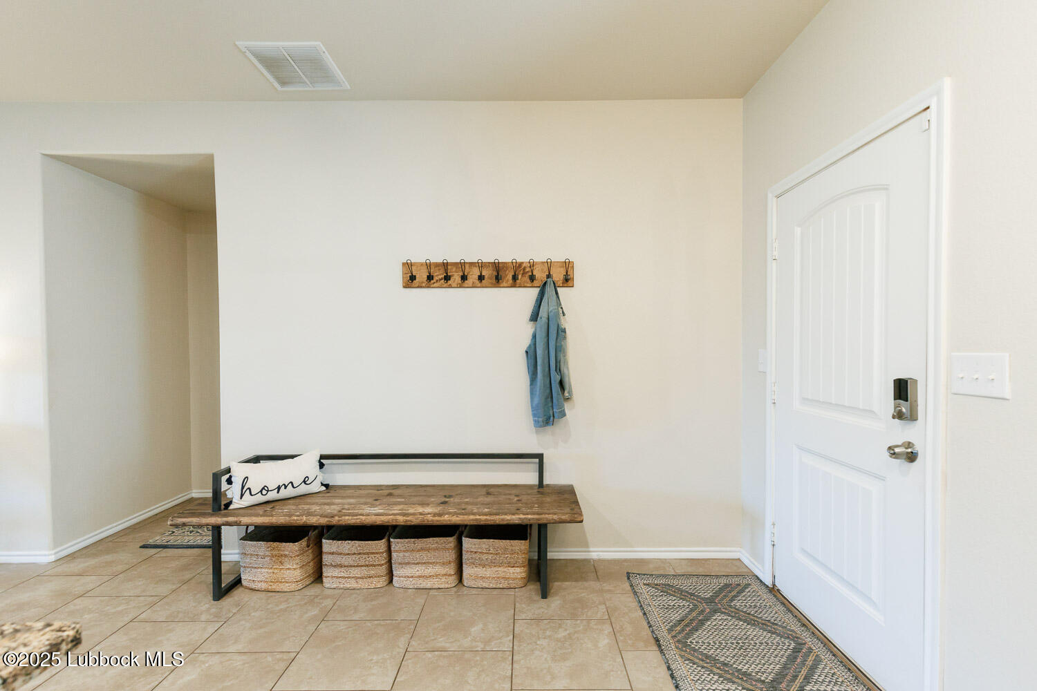 7348 100th Street Lubbock, TX 79424 - Photo 5 of 55 a reading room with furniture and wooden floor