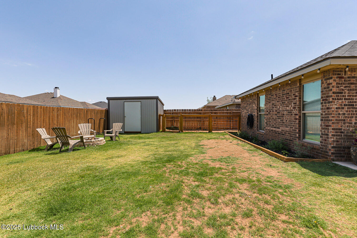 7348 100th Street Lubbock, TX 79424 - Photo 51 of 55 a view of a house with backyard and sitting area