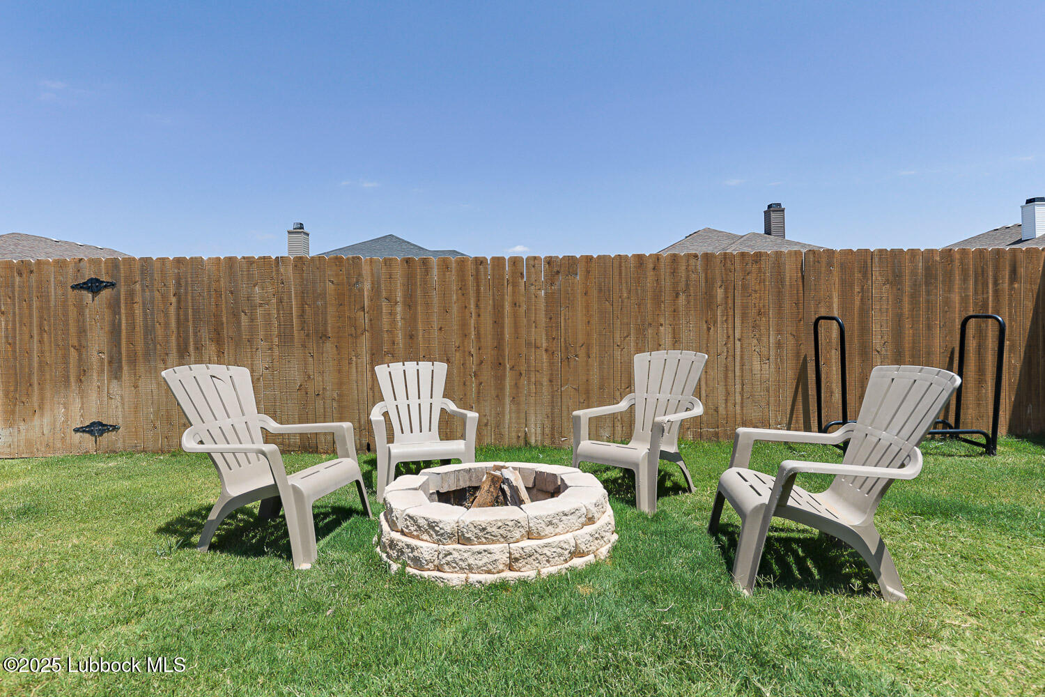 7348 100th Street Lubbock, TX 79424 - Photo 52 of 55 a view of a chairs in backyard of the house
