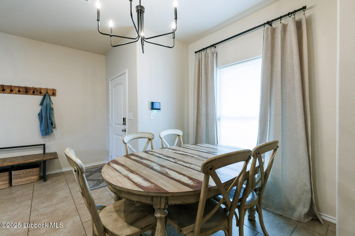 7348 100th Street Lubbock, TX 79424 - Photo 9 of 55 a view of a dining room with furniture and a window