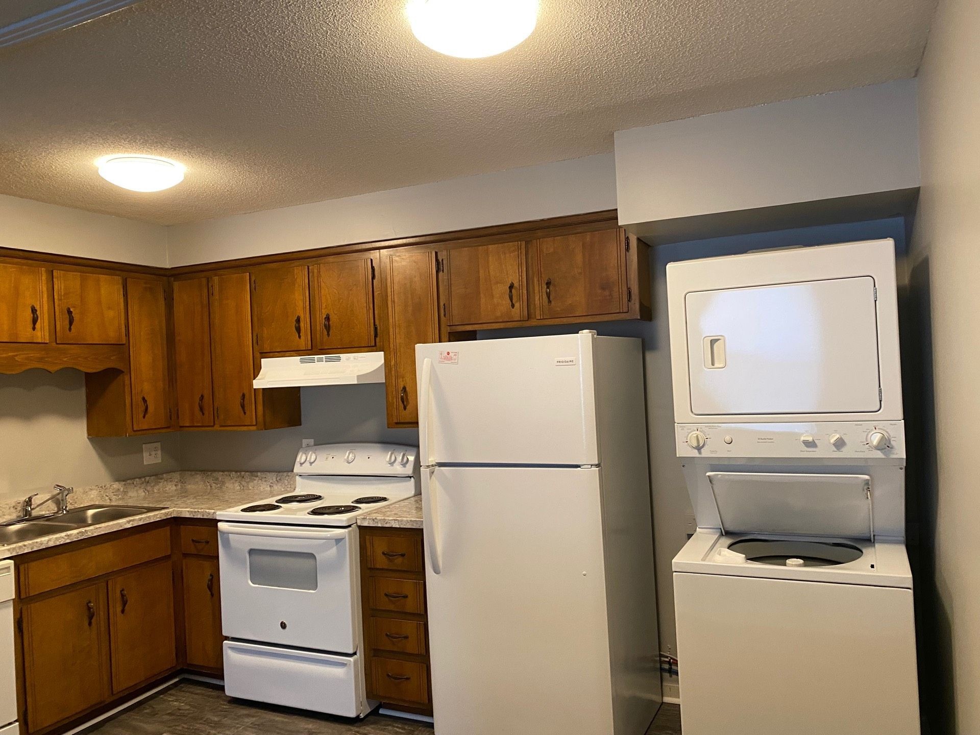 526 Main Street, Unit 6 Clarksville, TN 37040 - Photo 5 of 10 a kitchen with a refrigerator sink stove and cabinets