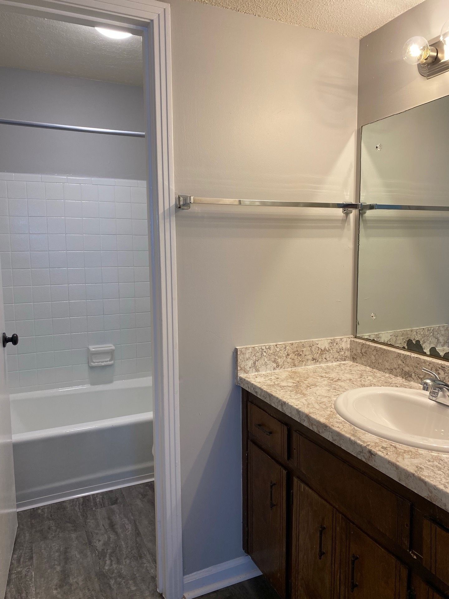 526 Main Street, Unit 6 Clarksville, TN 37040 - Photo 8 of 10 a bathroom with a granite countertop sink and a mirror