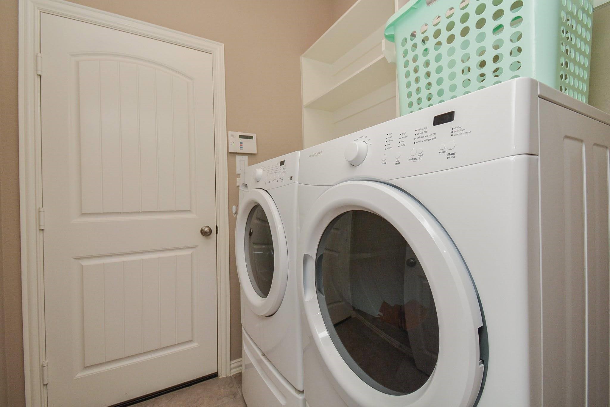 20414 Duncan Run Lane Cypress, TX 77433 - Photo 13 of 18 a utility room with dryer and washer