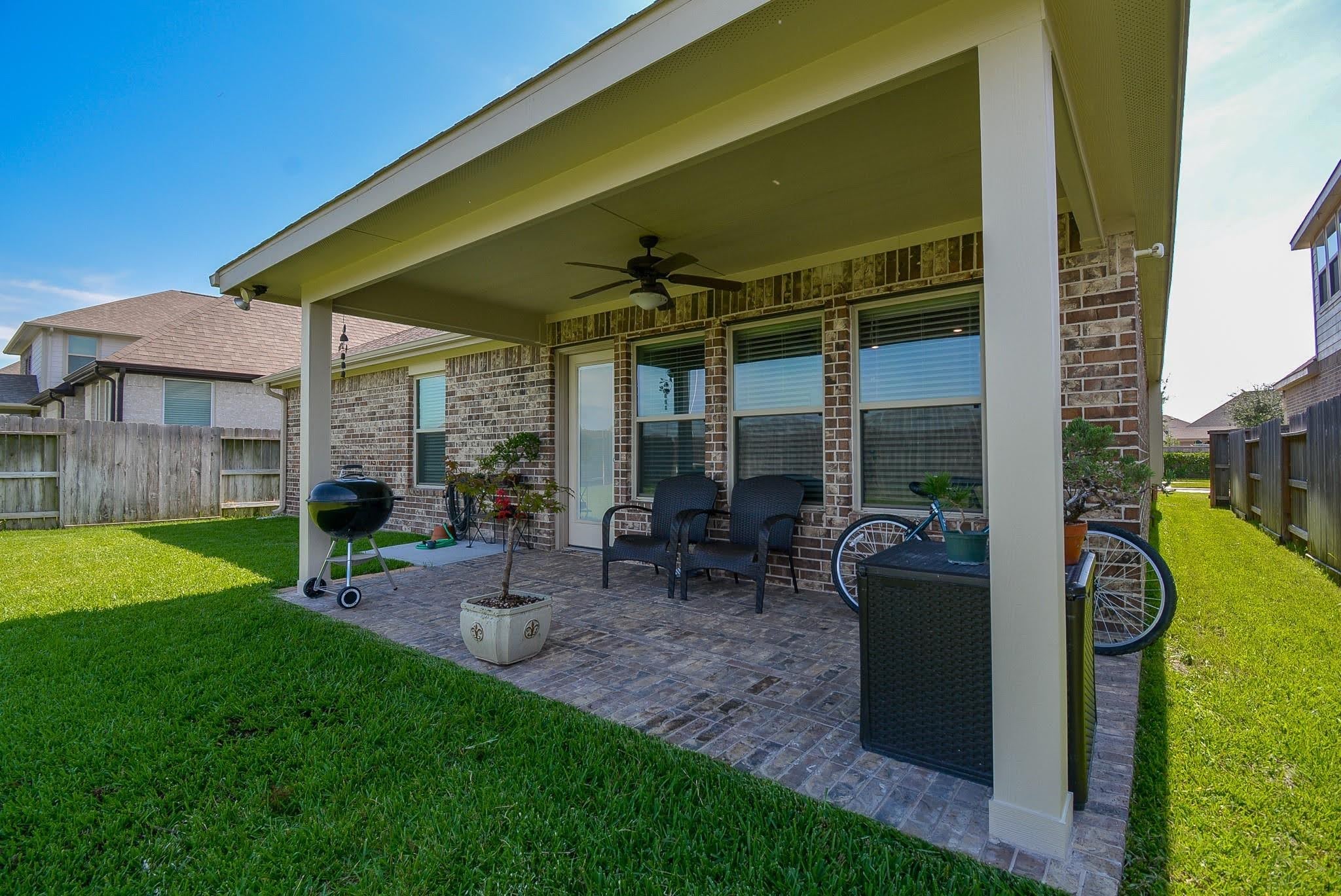 20414 Duncan Run Lane Cypress, TX 77433 - Photo 18 of 18 a view of a chair and table in backyard of house