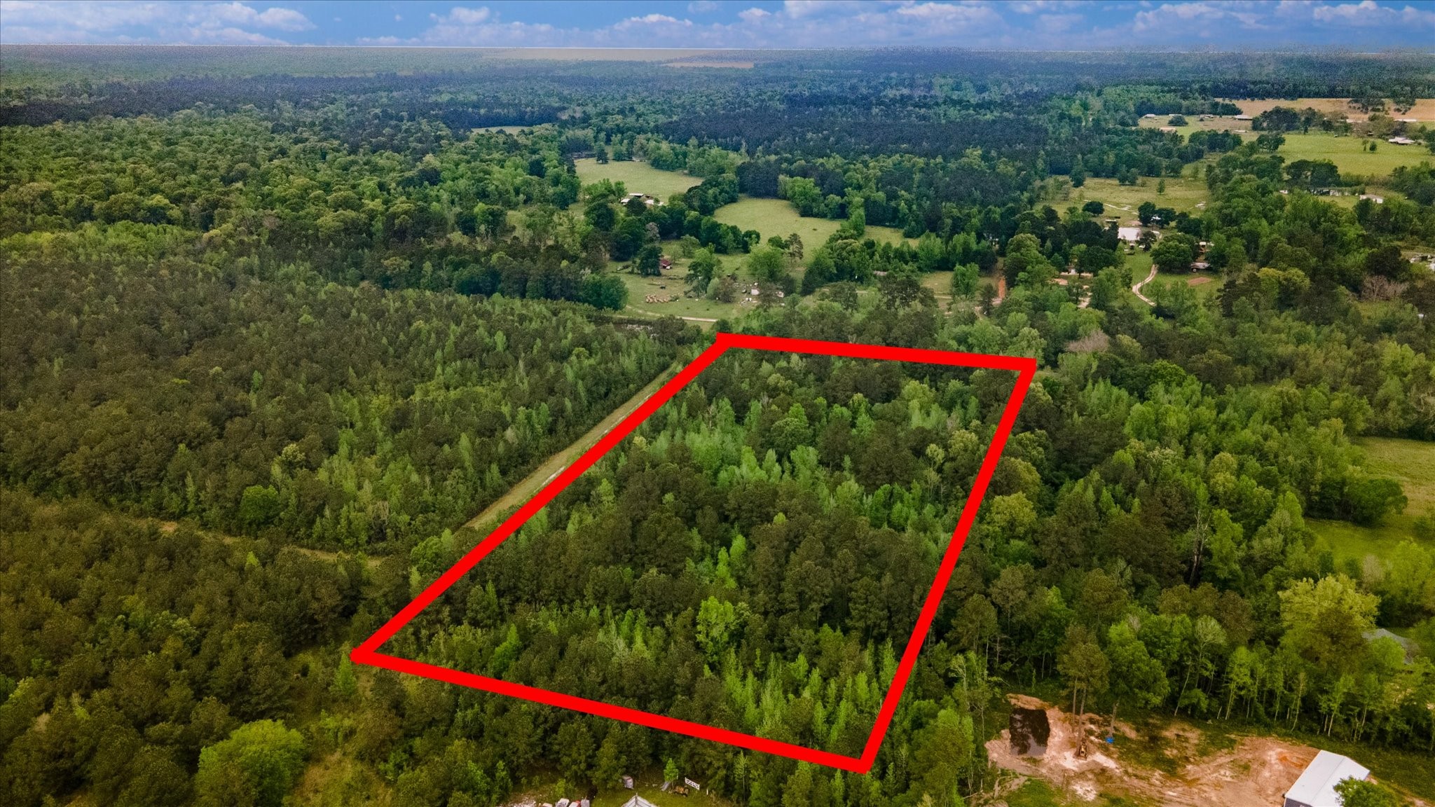 Tbd Shaw Road Hull, TX 77564 - Photo 30 of 31 a view of a field with a flower and a wooden fence