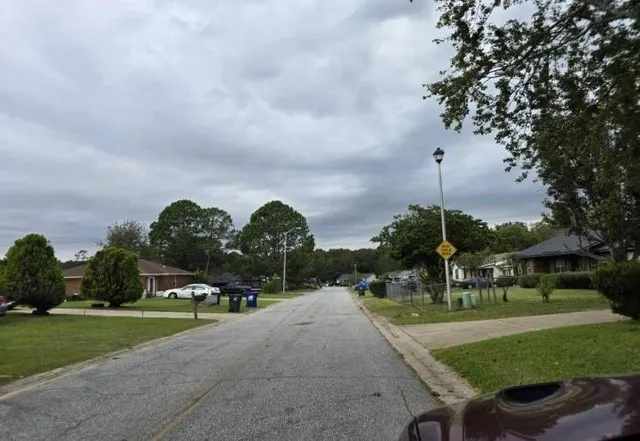 a childrens park with lots of swings and slides