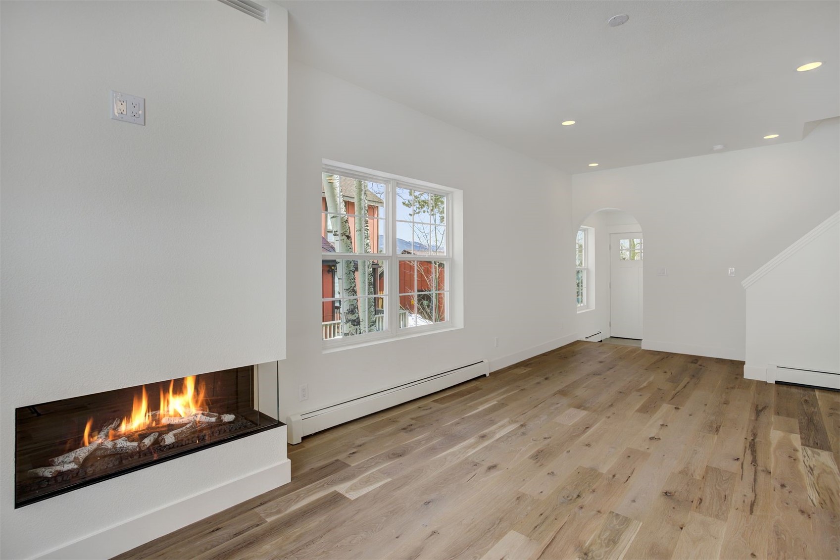 22 North Side Circle Silverthorne, CO 80498 - Photo 12 of 28 a view of an empty room with wooden floor and a window