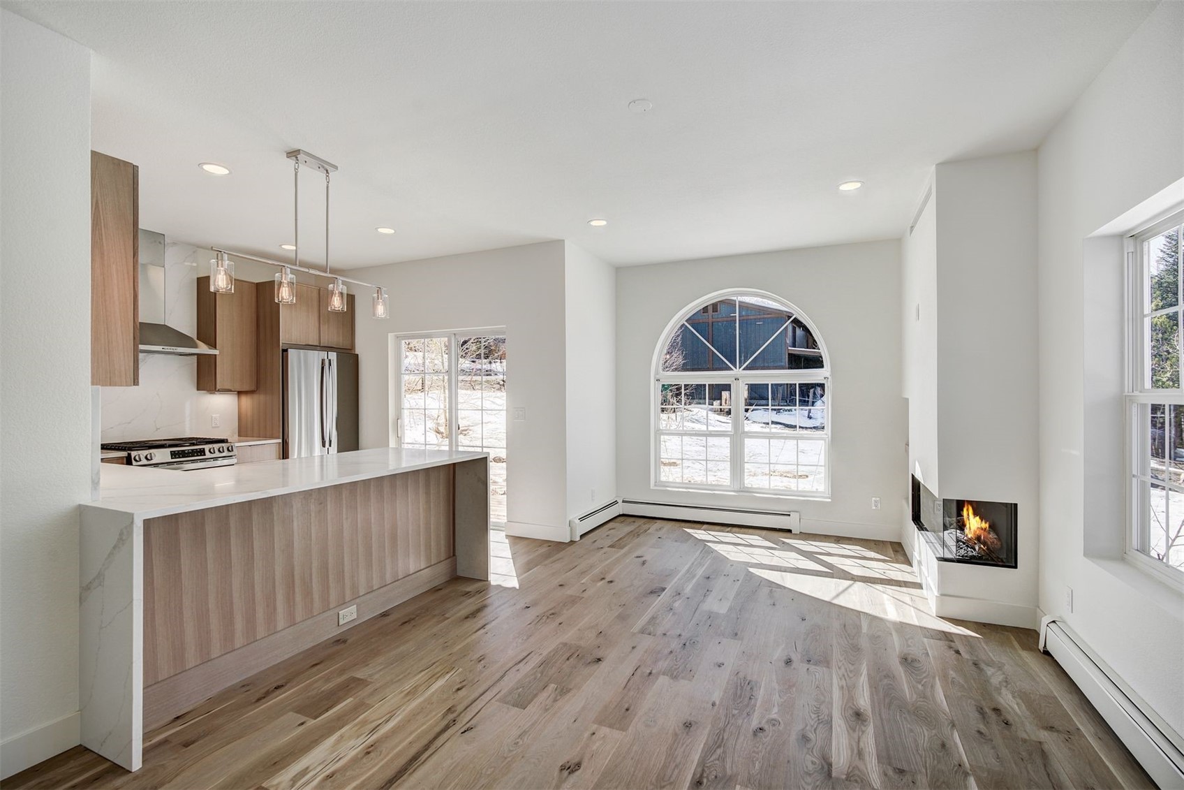 22 North Side Circle Silverthorne, CO 80498 - Photo 13 of 28 a view of kitchen with stainless steel appliances granite countertop a stove top oven a sink dishwasher and a refrigerator with wooden floors