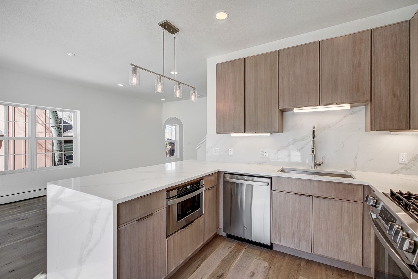 22 North Side Circle Silverthorne, CO 80498 - Photo 17 of 28 a kitchen that has a sink and a stove in it