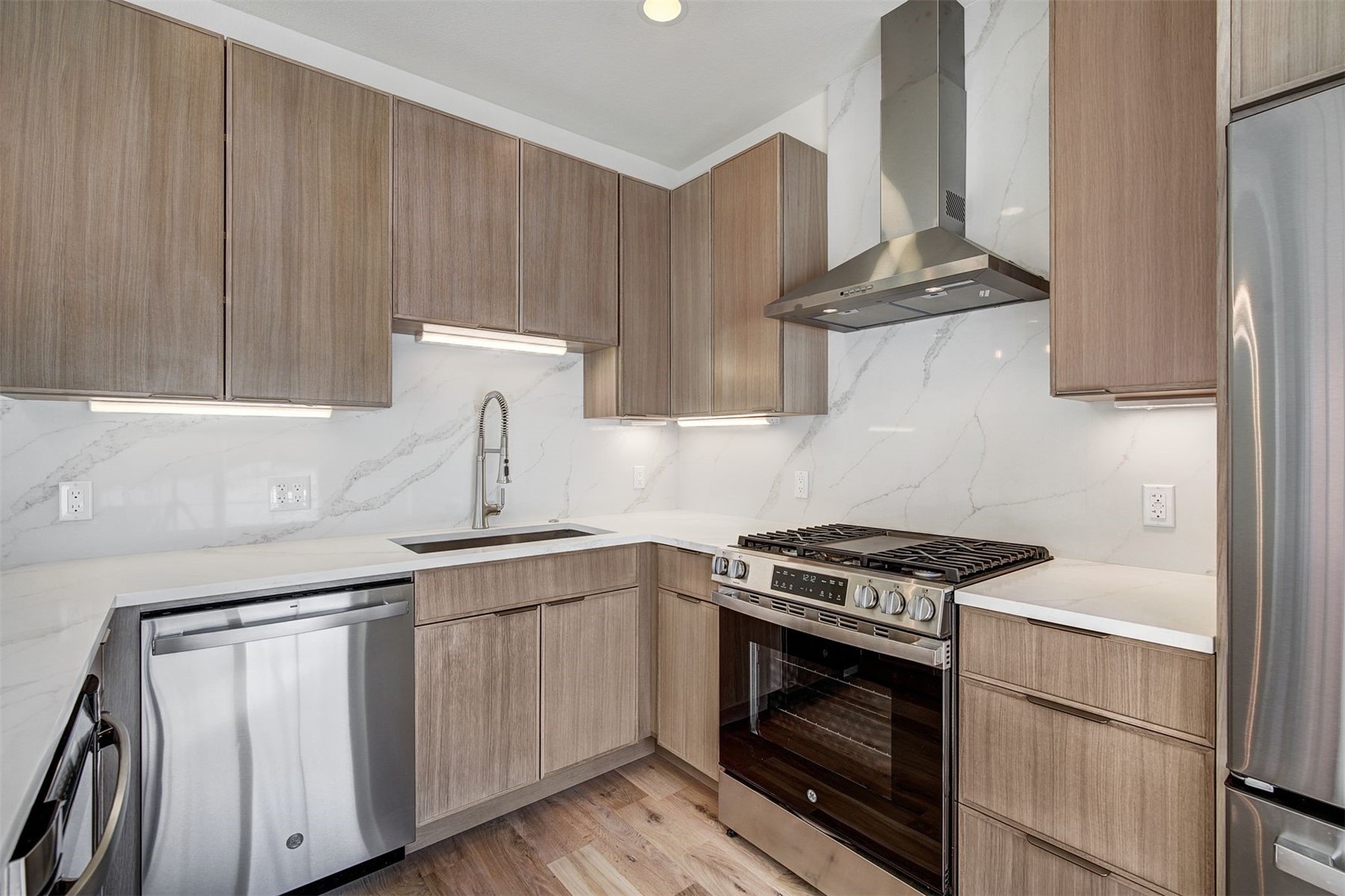 22 North Side Circle Silverthorne, CO 80498 - Photo 2 of 28 a kitchen with stainless steel appliances a stove a sink and a refrigerator