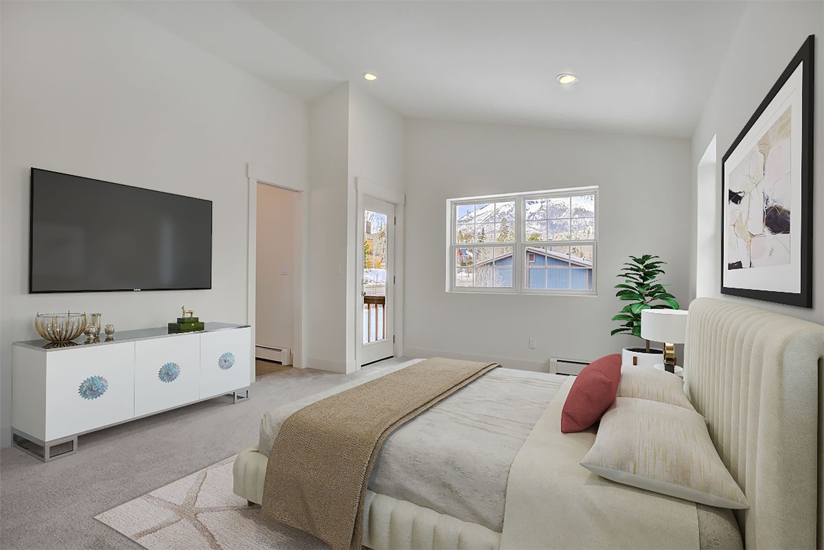 22 North Side Circle Silverthorne, CO 80498 - Photo 5 of 28 a bedroom with a bed and flat screen tv