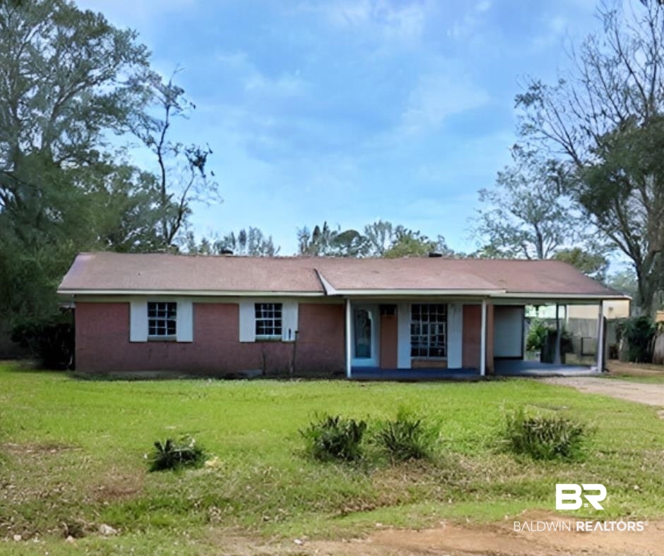 204 Quinley Street Bay Minette, AL 36507 - Photo 1 of 15 Ranch-style home with a front lawn and a carport