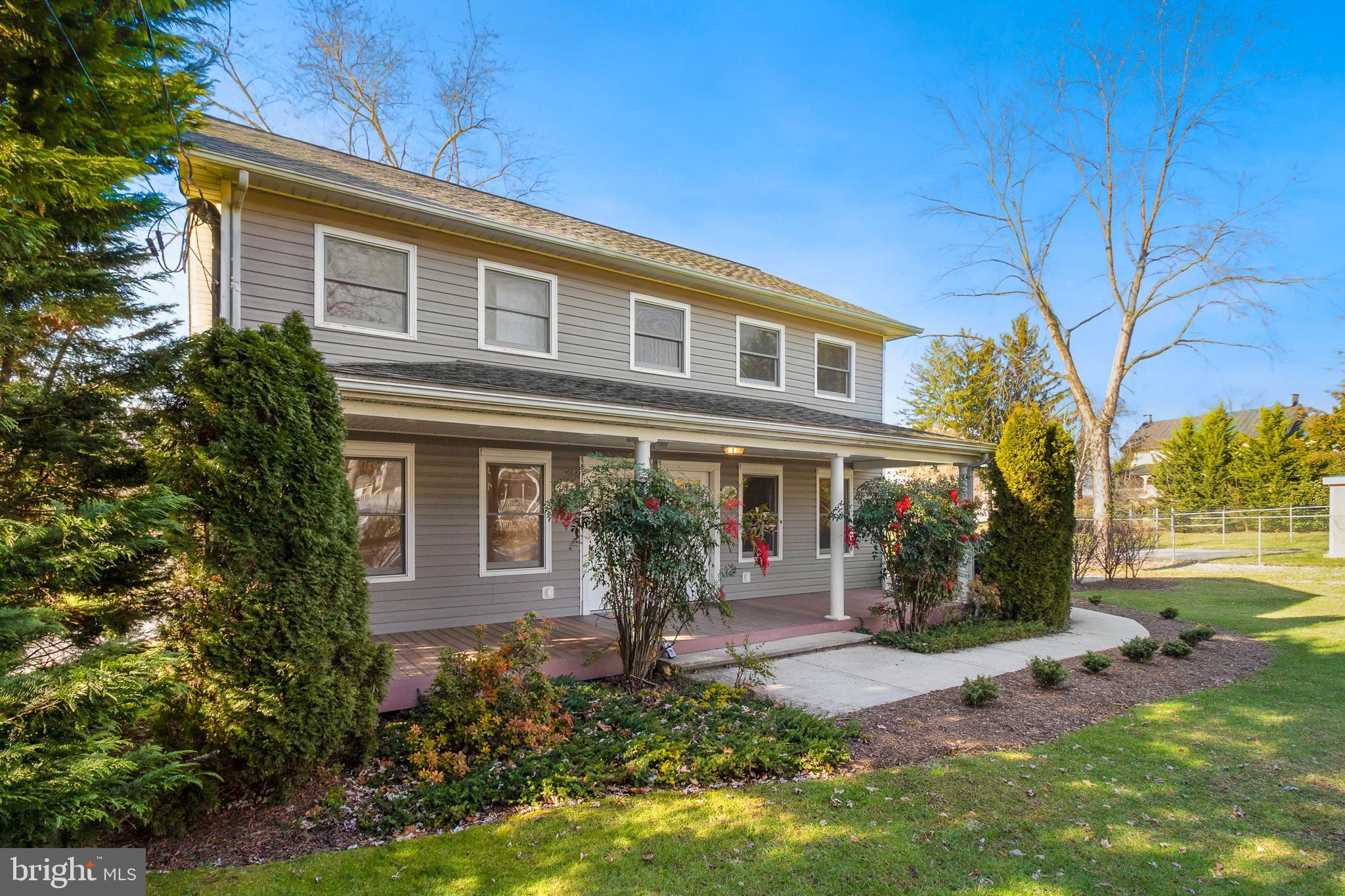 112 Main Street, Unit A New Windsor, MD 21776 - Photo 3 of 39 a front view of a house with garden