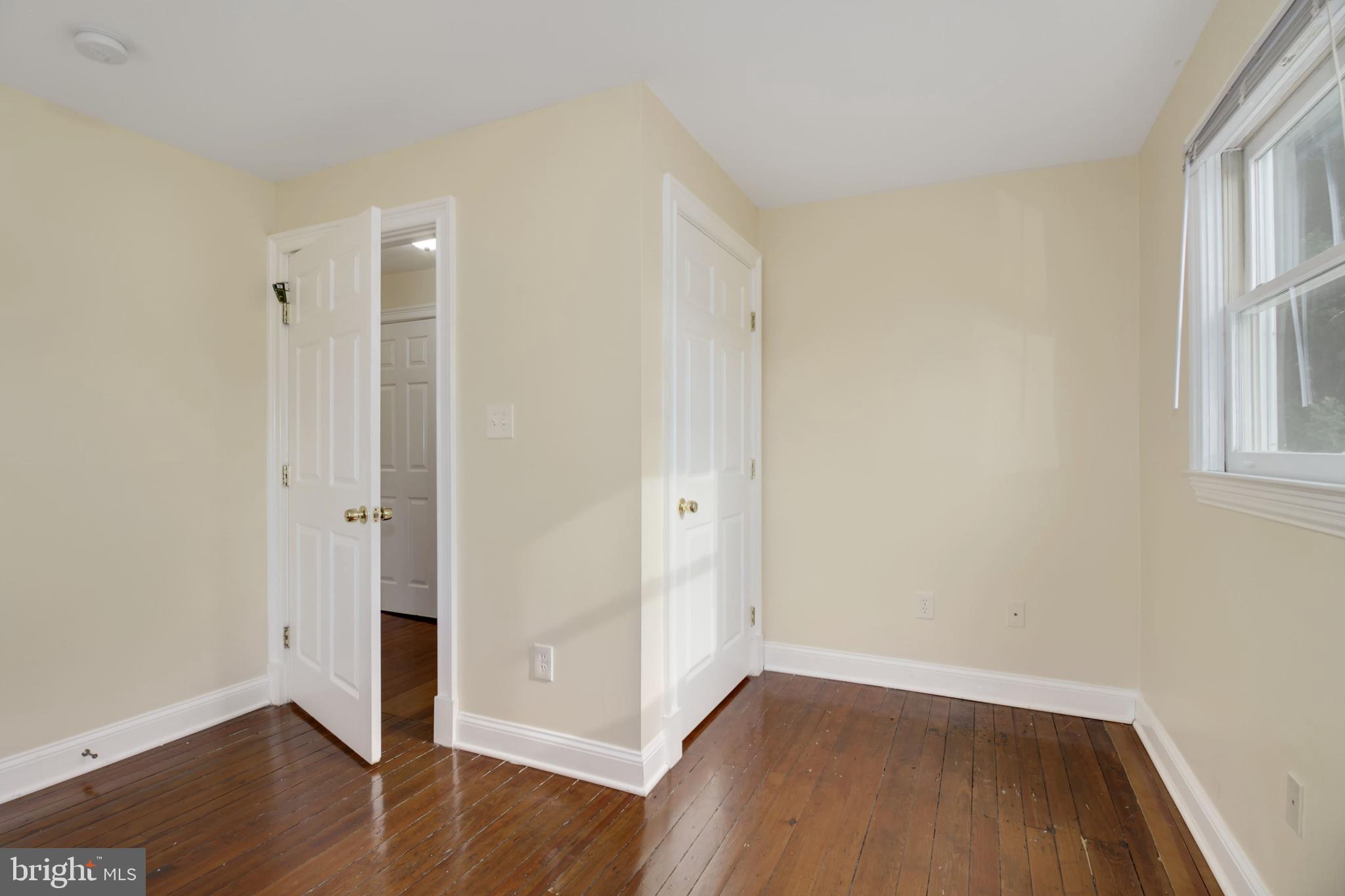 112 Main Street, Unit A New Windsor, MD 21776 - Photo 30 of 39 an empty room with wooden floor