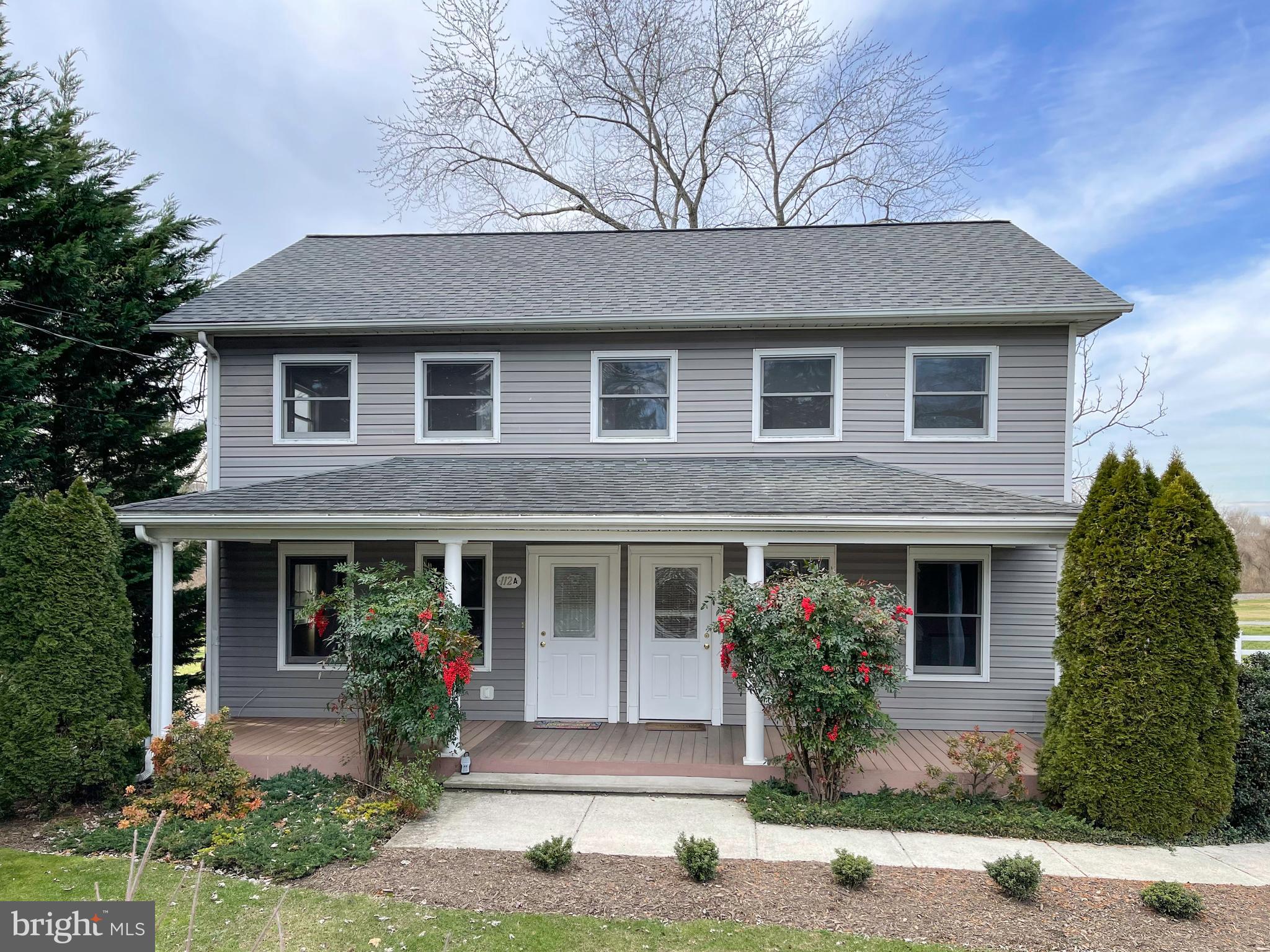 112 Main Street, Unit A New Windsor, MD 21776 - Photo 4 of 39 a front view of a house with garden