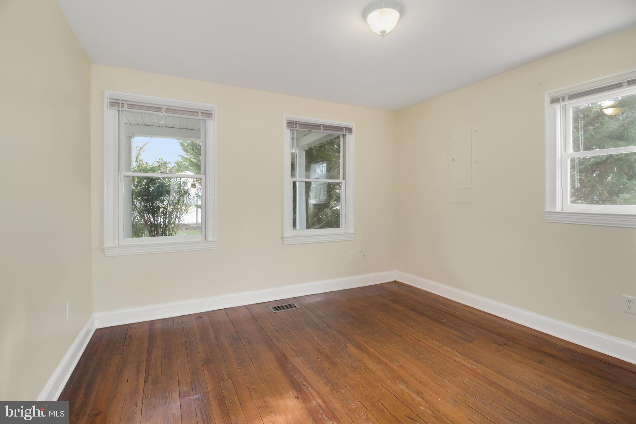 112 Main Street, Unit A New Windsor, MD 21776 - Photo 33 of 39 a view of an empty room with wooden floor and a window