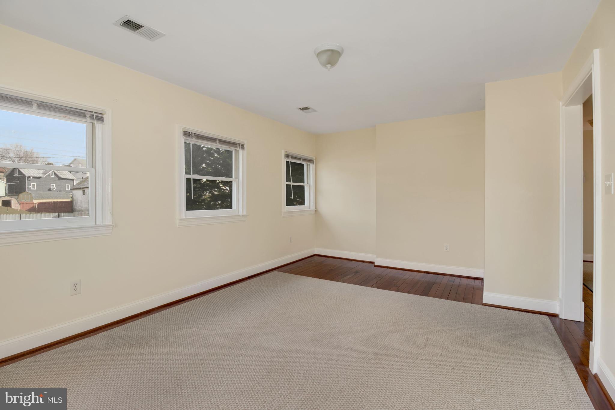 112 Main Street, Unit A New Windsor, MD 21776 - Photo 9 of 39 a view of an empty room with a window
