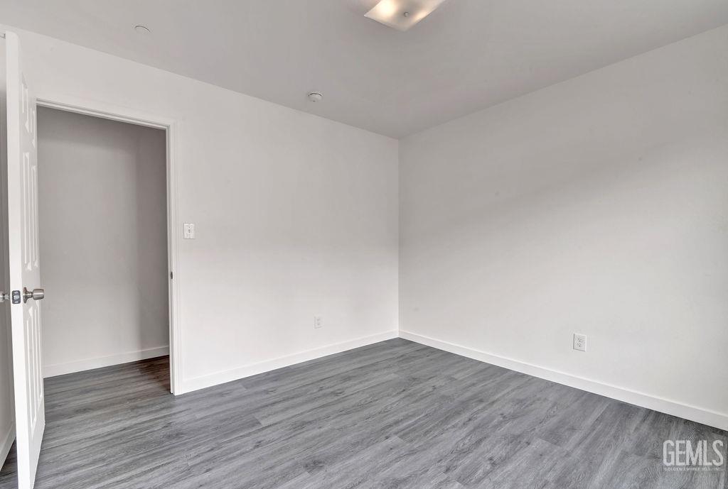 Undisclosed Address McFarland, CA 93250 - Photo 21 of 35 a view of an empty room with wooden floor