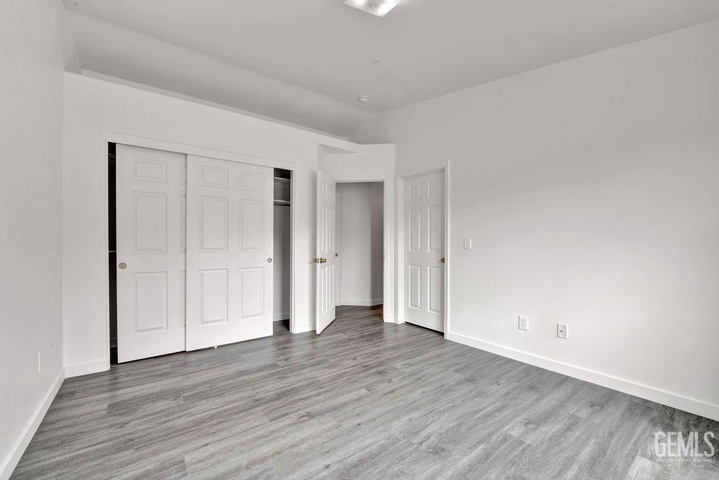 Undisclosed Address McFarland, CA 93250 - Photo 24 of 35 a view of empty room with wooden floor