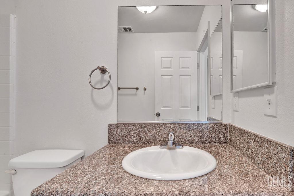 Undisclosed Address McFarland, CA 93250 - Photo 26 of 35 a bathroom with a sink a toilet and shower