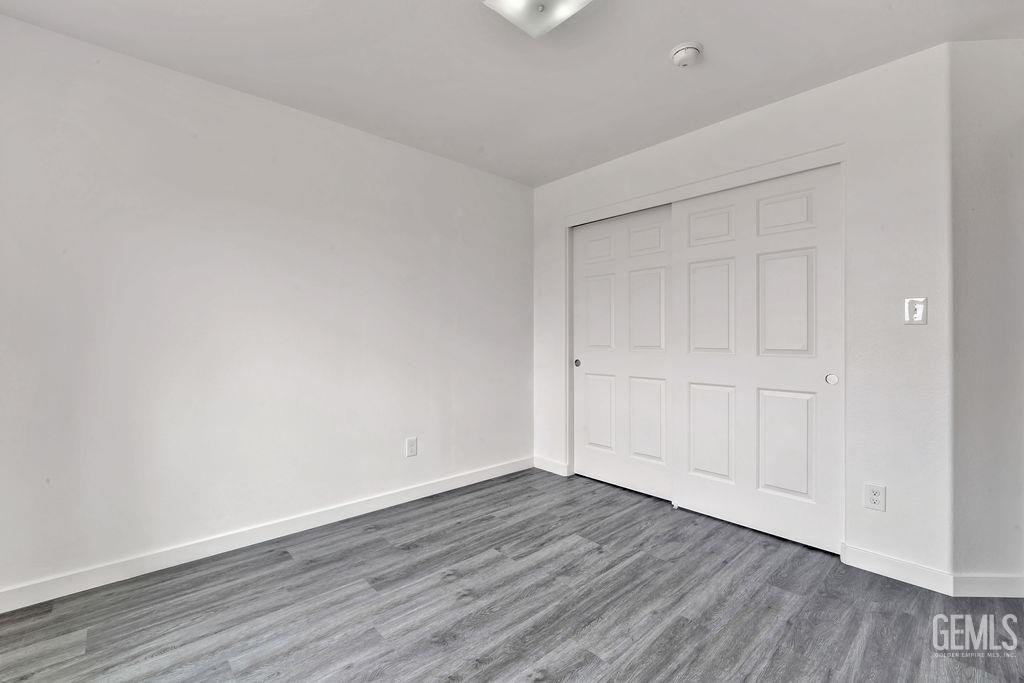 Undisclosed Address McFarland, CA 93250 - Photo 28 of 35 a view of an empty room with wooden floor