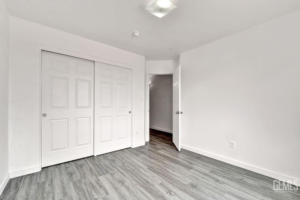 Undisclosed Address McFarland, CA 93250 - Photo 29 of 35 a view of an empty room and wooden floor